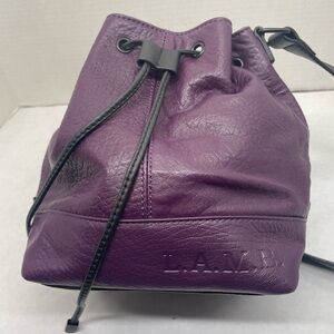 L.A.M.B GORGEOUS purple leather bucket bag with black leather strap